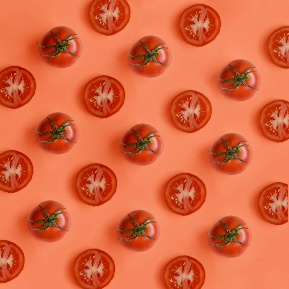 tomatoes arranged in a pattern on an orange background