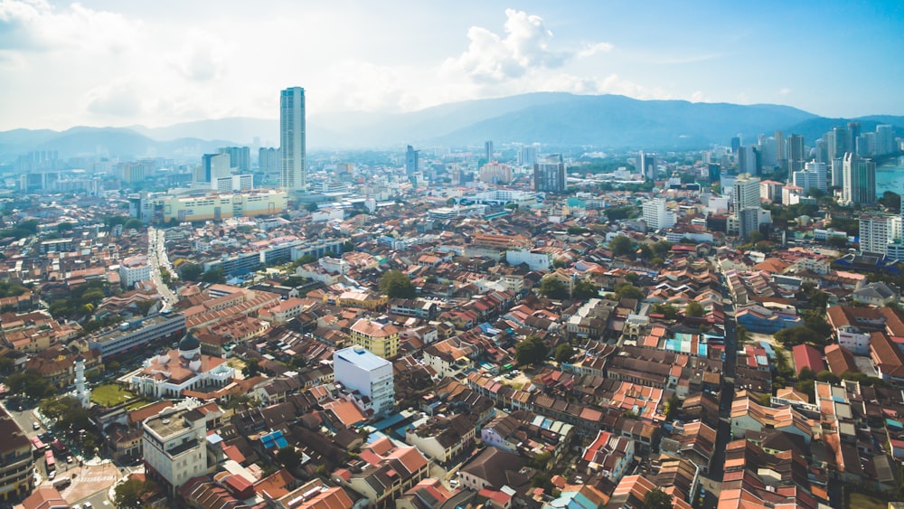 an aerial view of a city with tall buildings