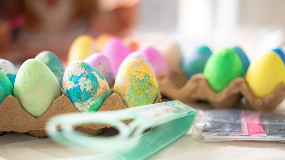 a close up of a tray of decorated eggs