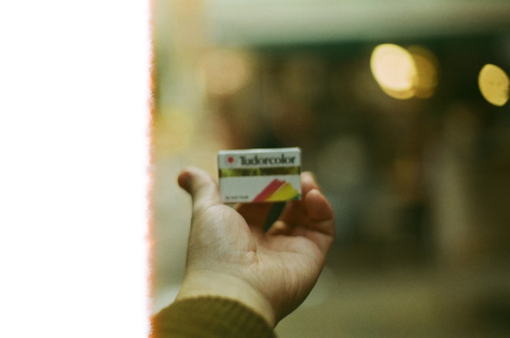 a person holding a card in their hand