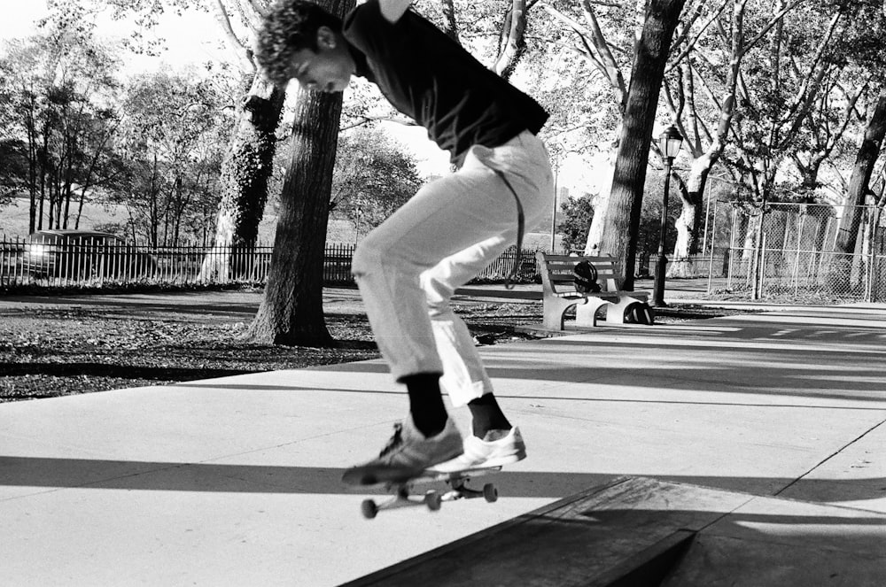 a man riding a skateboard up the side of a ramp