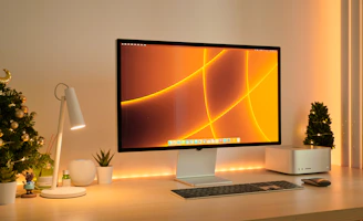 a computer monitor sitting on top of a desk
