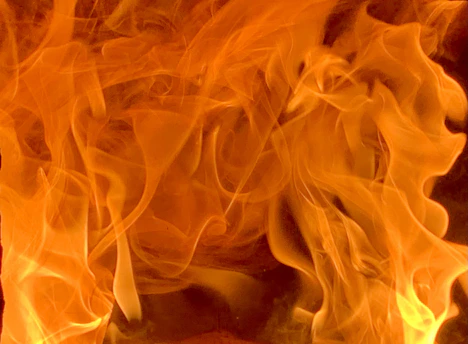 a close up of a fire burning in a fireplace