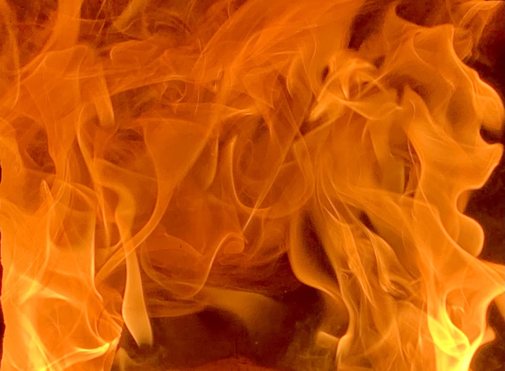 a close up of a fire burning in a fireplace