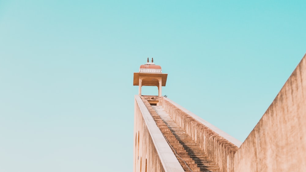 a tall building with a small tower on top of it