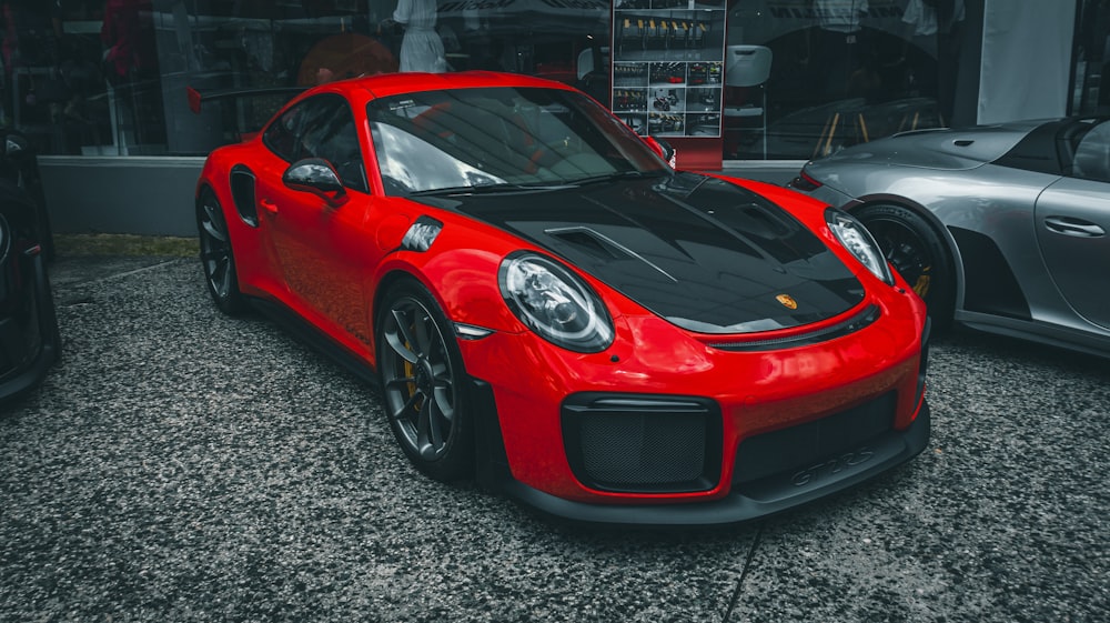 a red sports car parked in front of a building