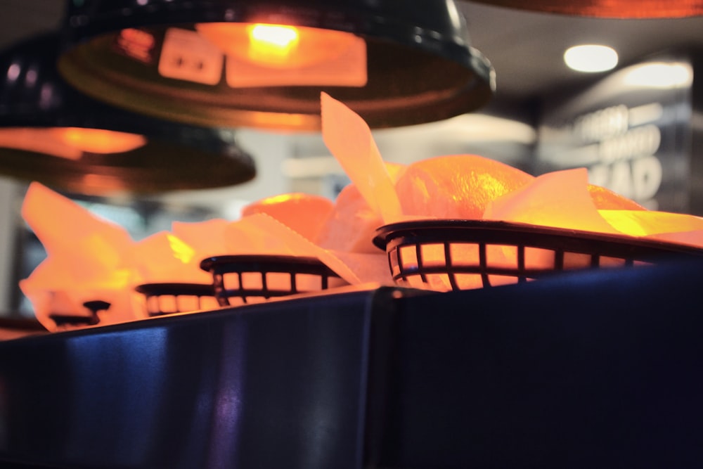 a basket filled with oranges sitting on top of a counter