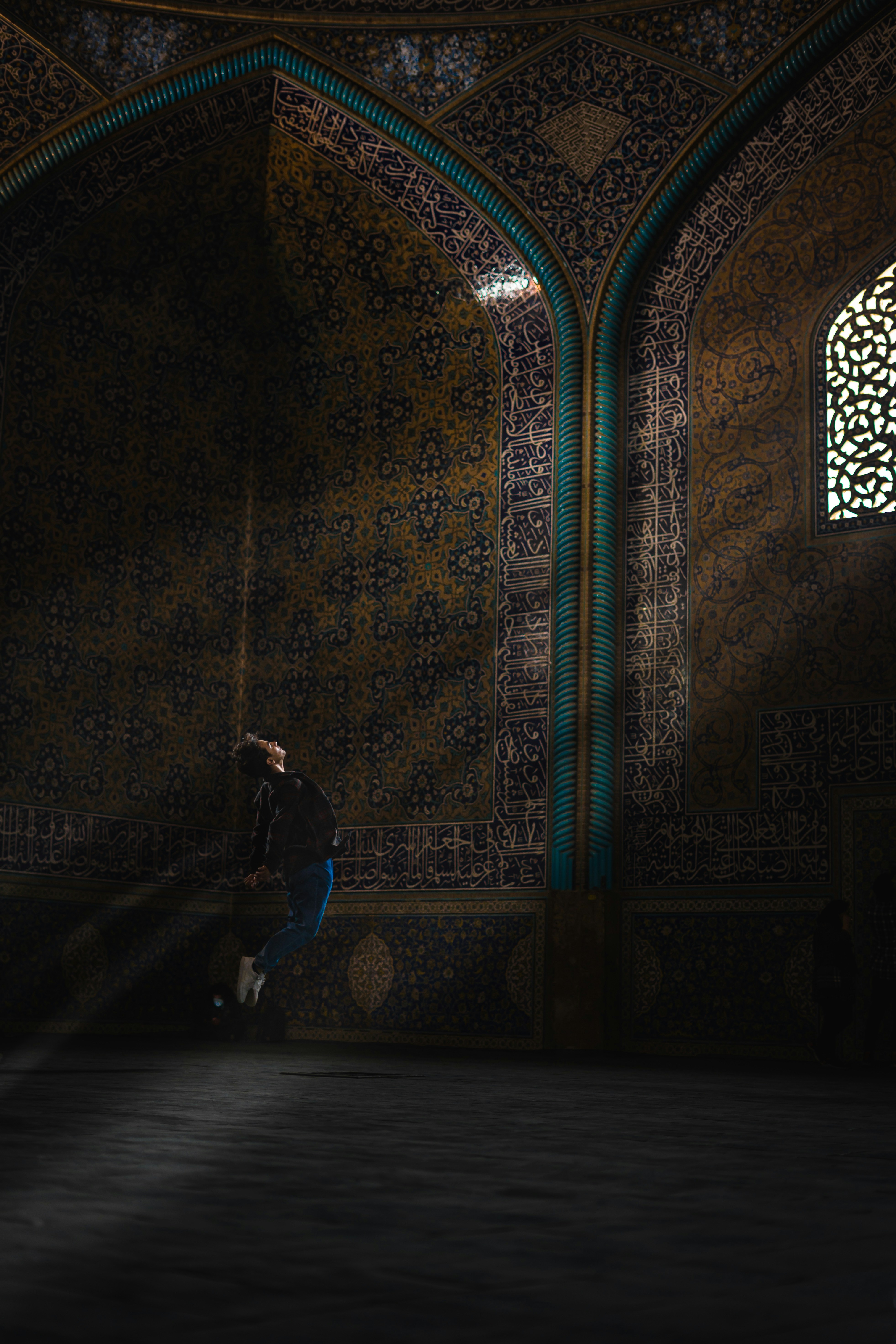 a person standing in a dimly lit room
