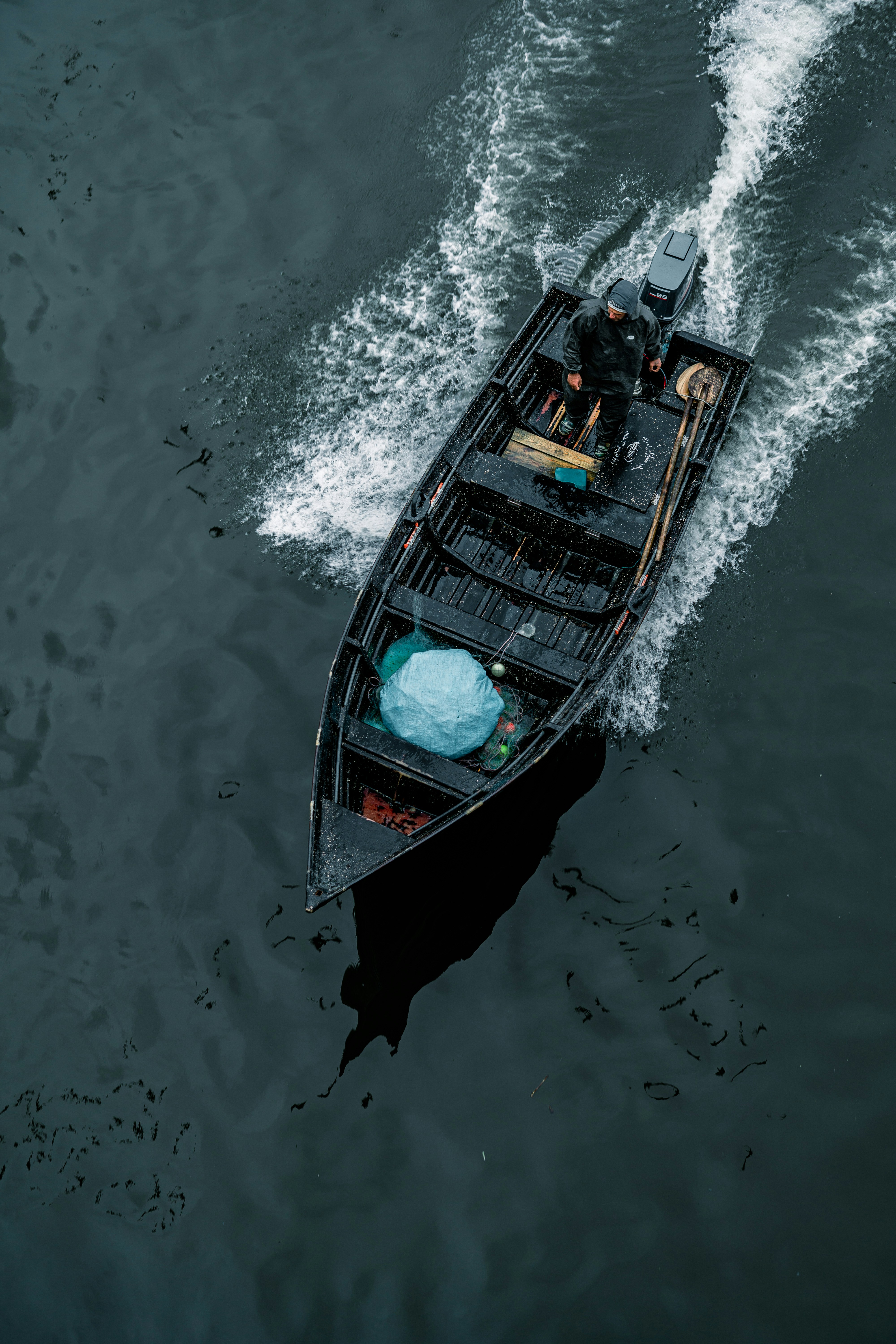 a small boat in the middle of a body of water