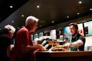 a man ordering food at a fast food restaurant