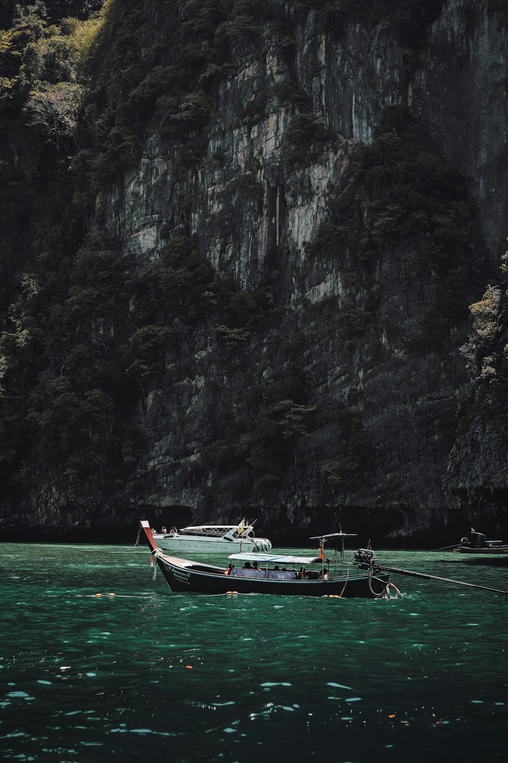 a boat floating on top of a body of water