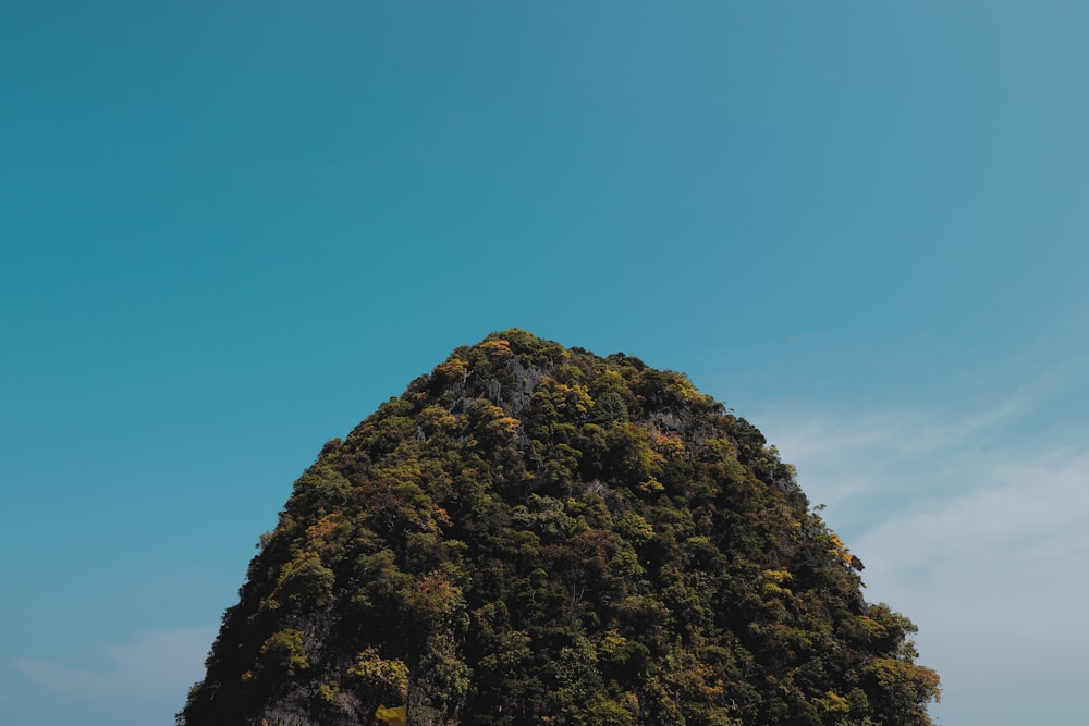 a large rock in the middle of a body of water