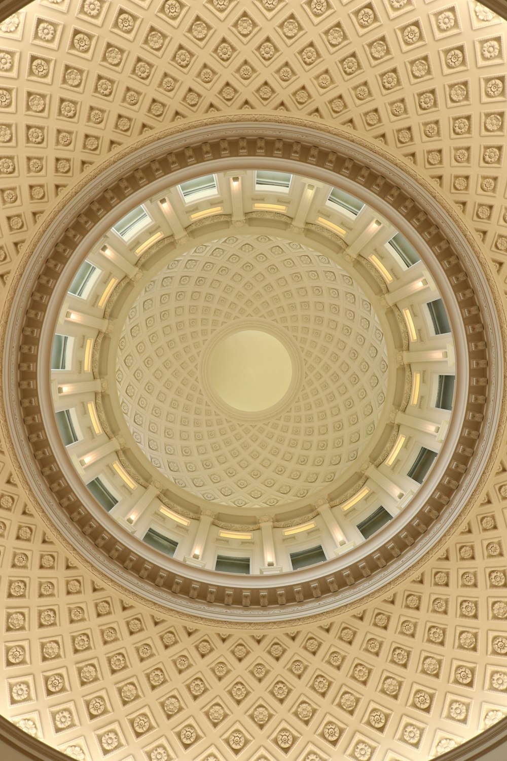 the ceiling of a building with a circular design