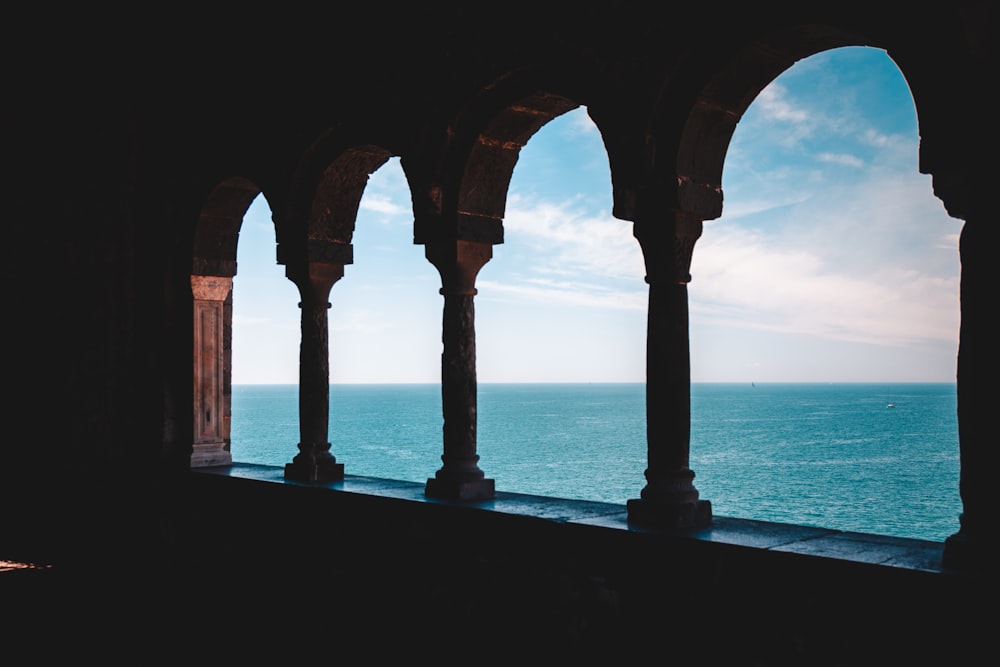 a view of the ocean from a window in a building