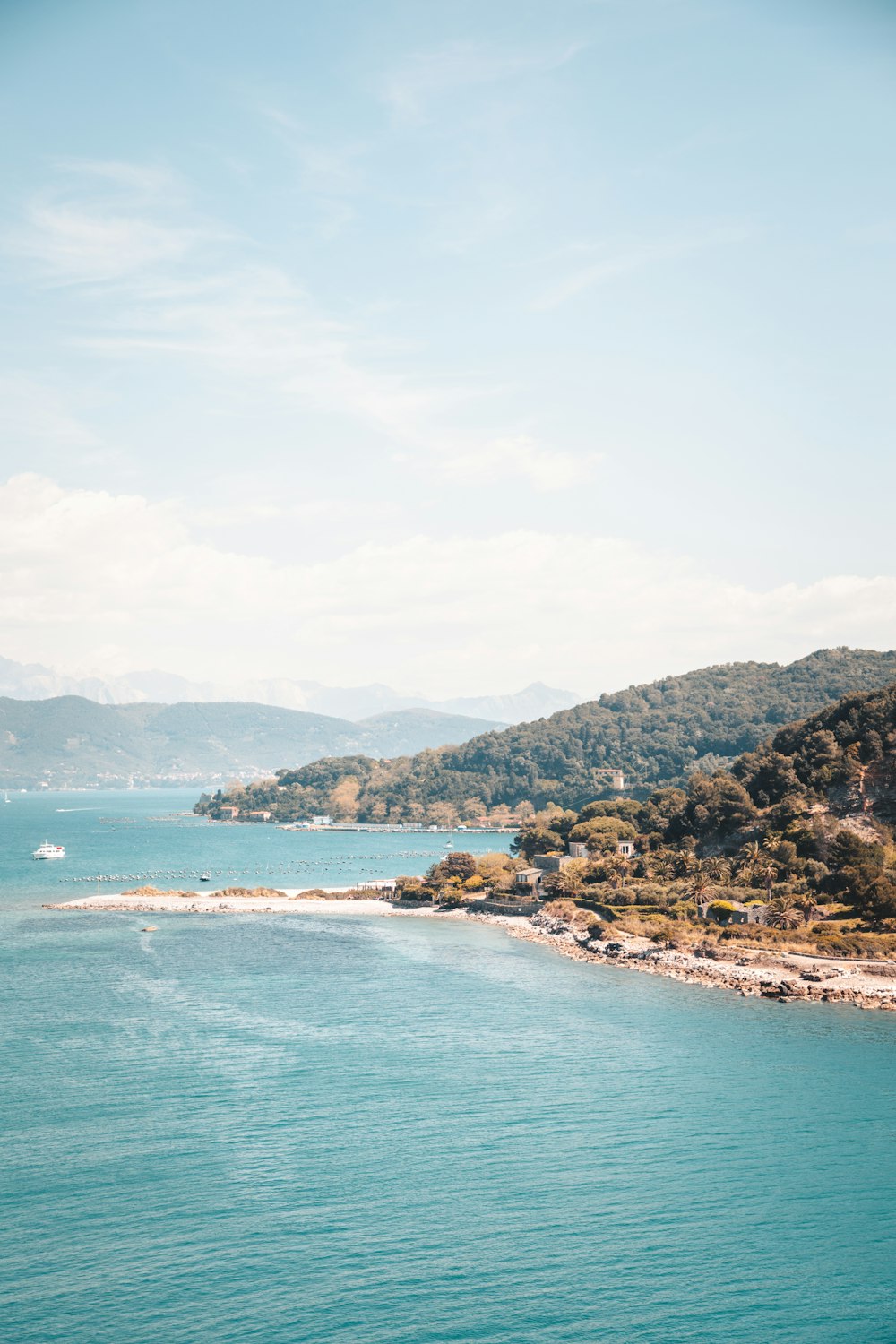 a body of water surrounded by hills and trees