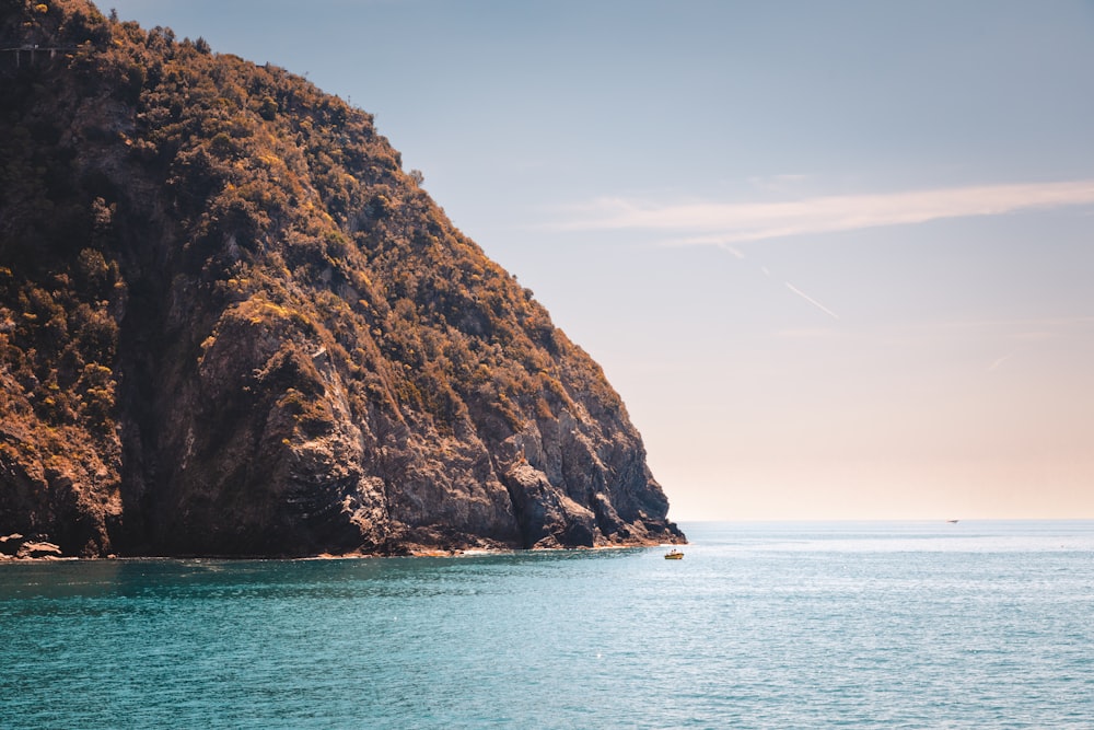 a large rock outcropping into the ocean