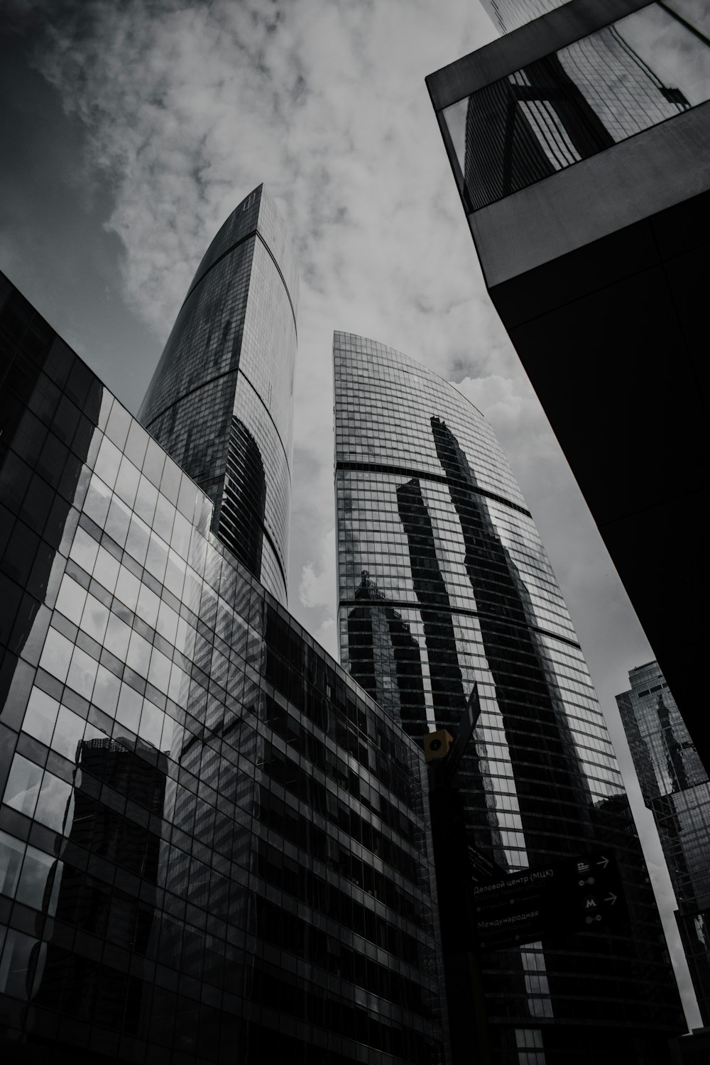 a black and white photo of some very tall buildings