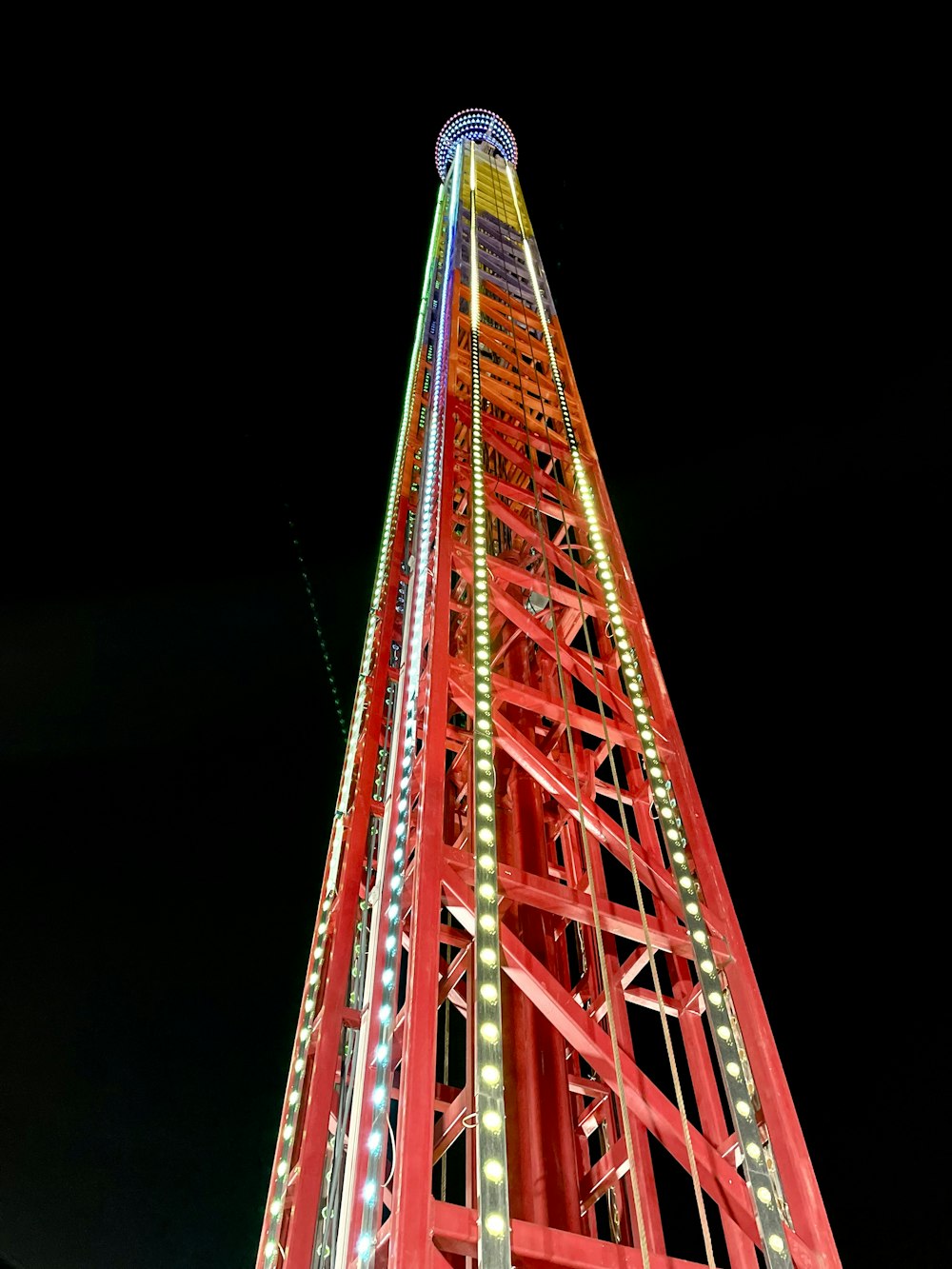 a very tall tower with a clock on it's side