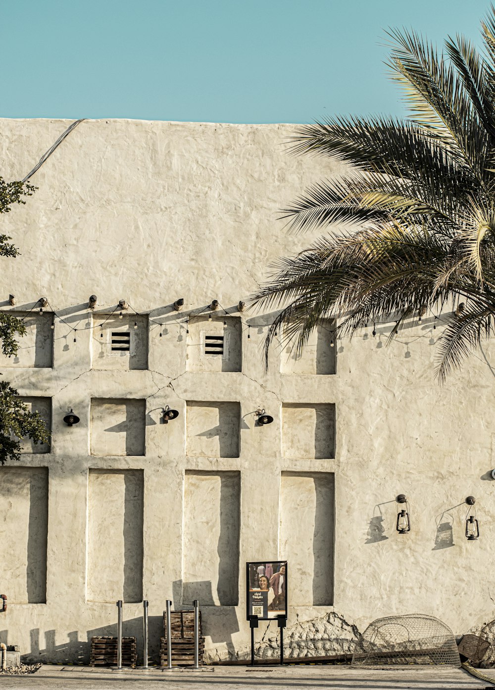 a building with a palm tree in front of it