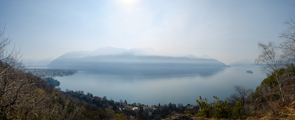 a large body of water surrounded by trees