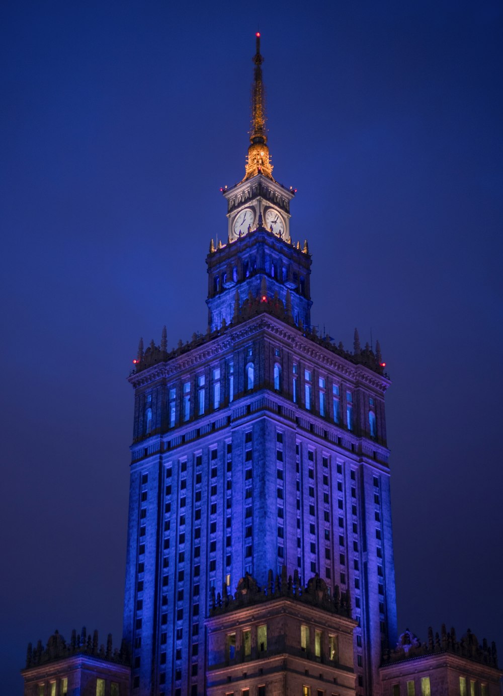 a very tall building with a clock on it's side