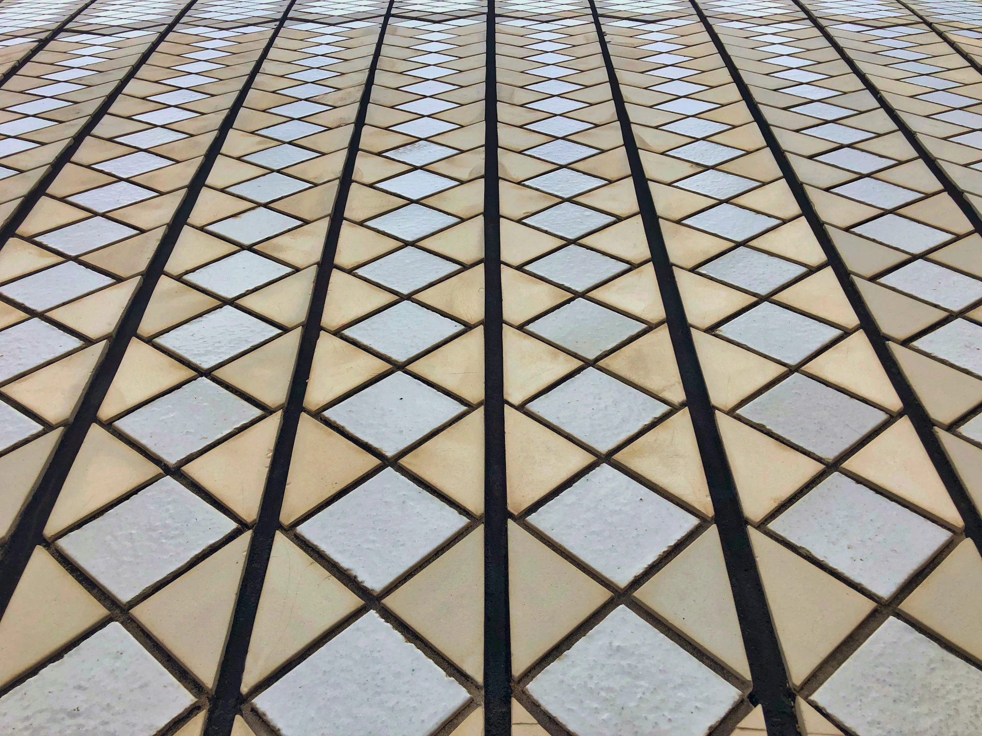 a close up view of a building's glass and stone facade