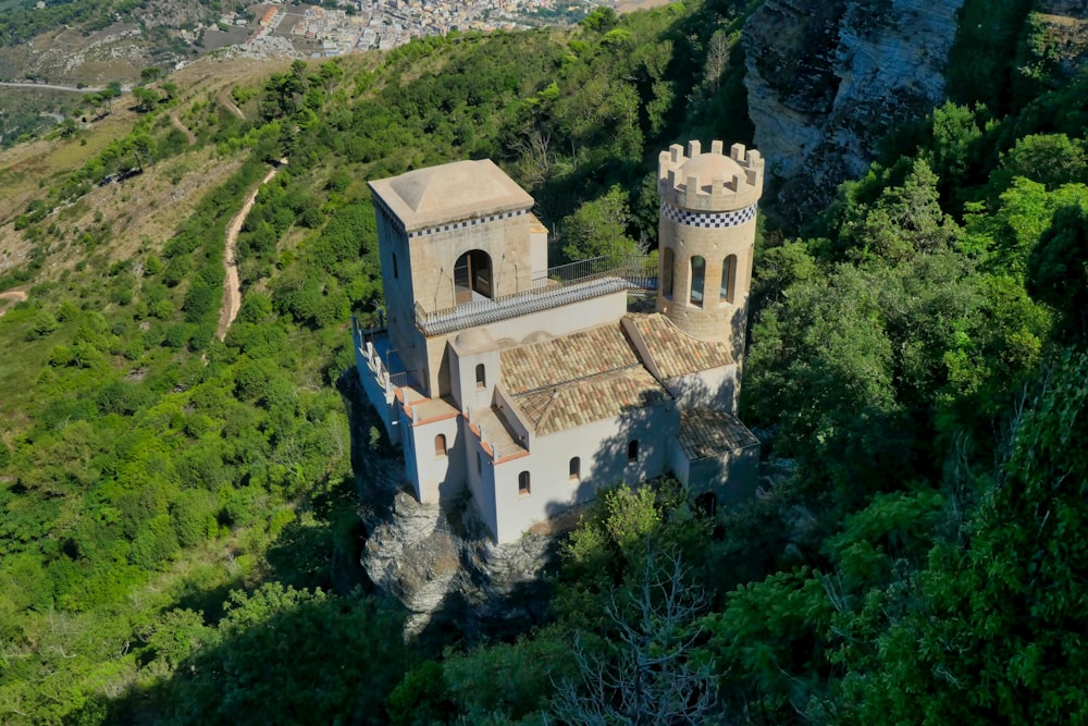 an aerial view of a castle in the mountains