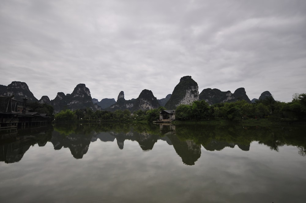 a body of water with mountains in the background