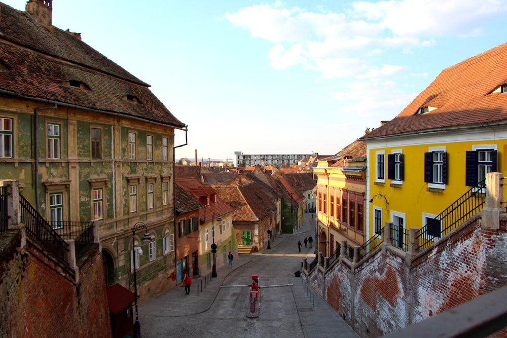 a city street with buildings and a fire hydrant