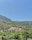 a scenic view of a village in the mountains