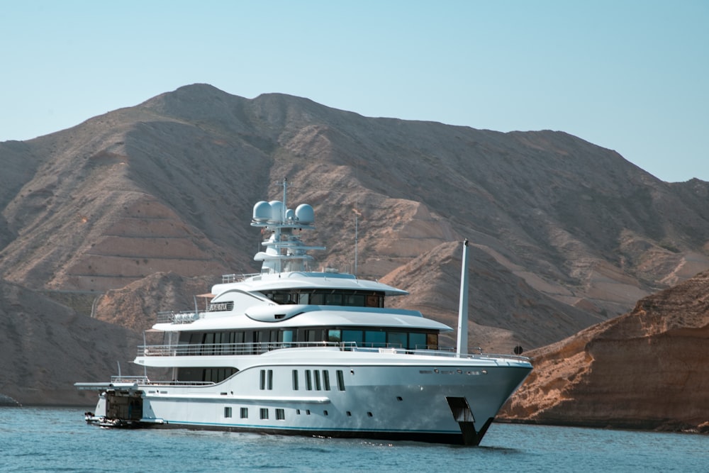 a large white boat floating on top of a body of water