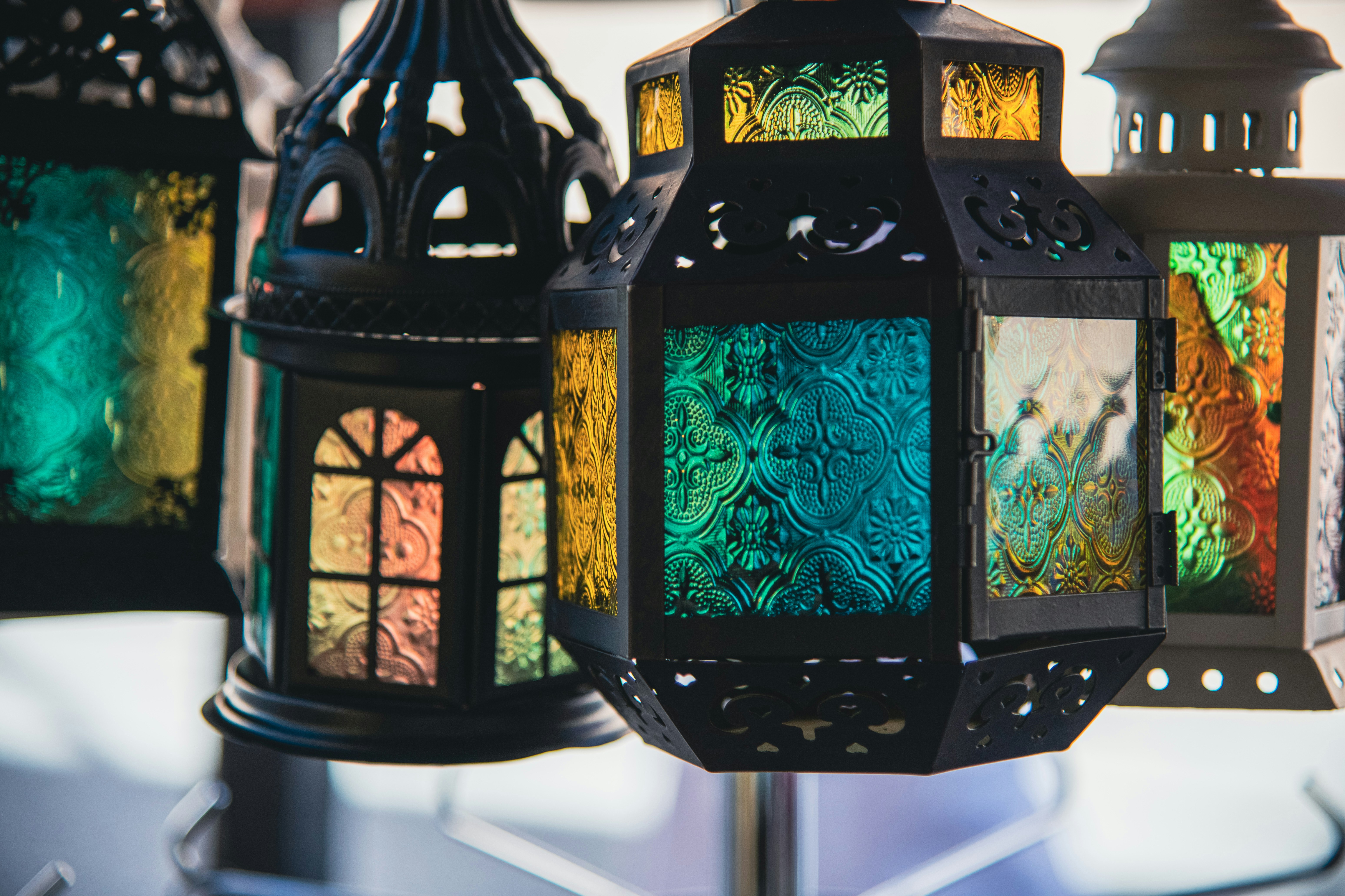 A group of colorful lanterns sitting on top of a table photo – Free ...
