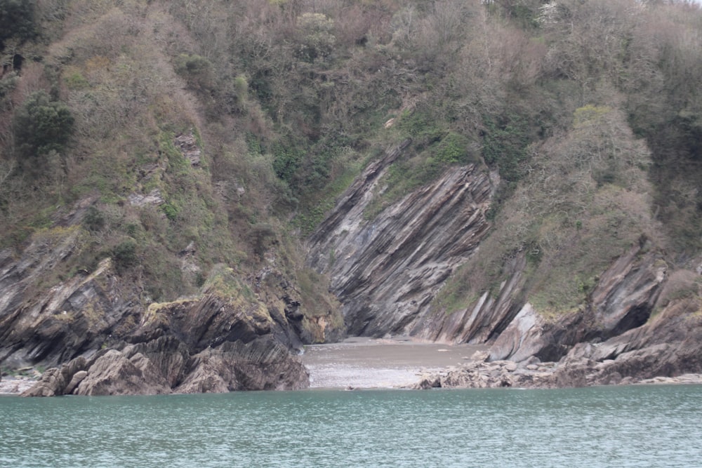 a body of water with a mountain in the background