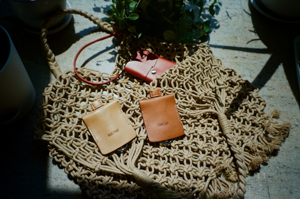 a couple of wallets sitting on top of a table