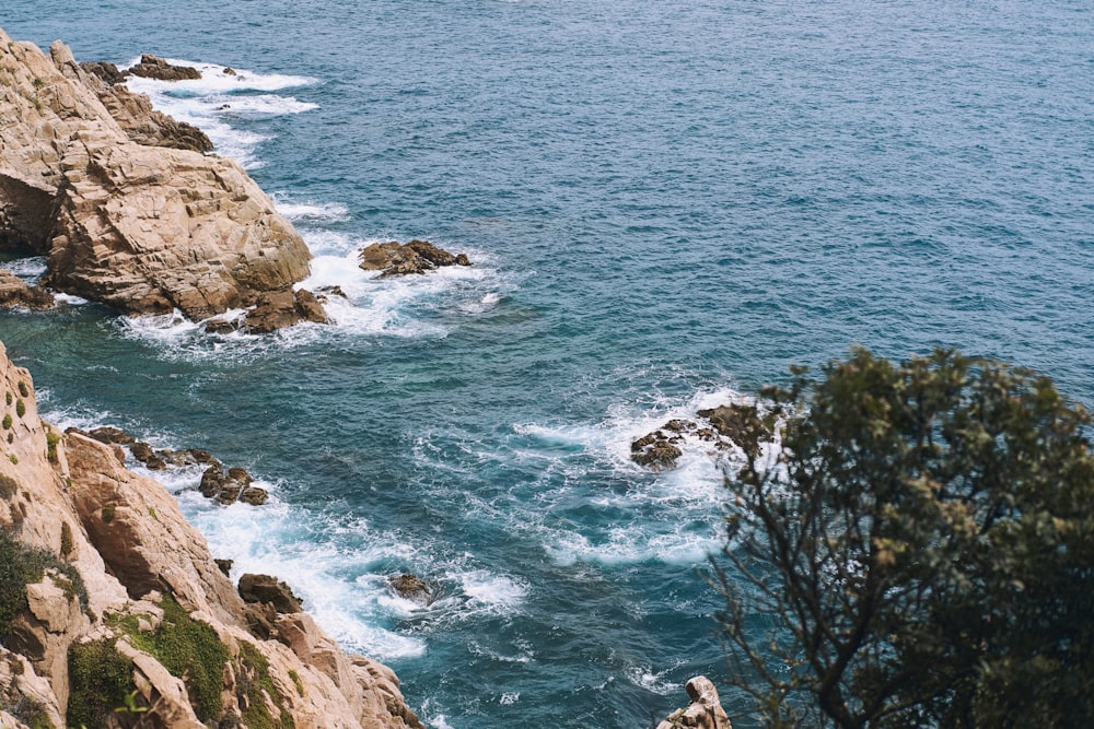 a view of the ocean from the top of a cliff