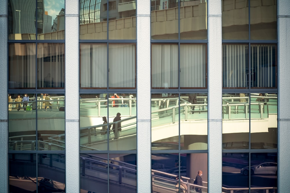 a reflection of a building in a glass window