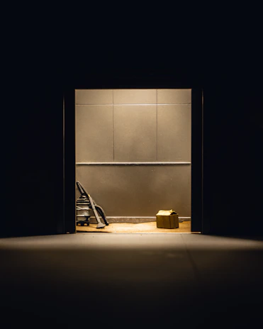 A sleek, modern vacuum cleaner shining under soft lighting on a clean floor