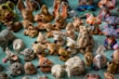 a table topped with lots of small figurines of animals