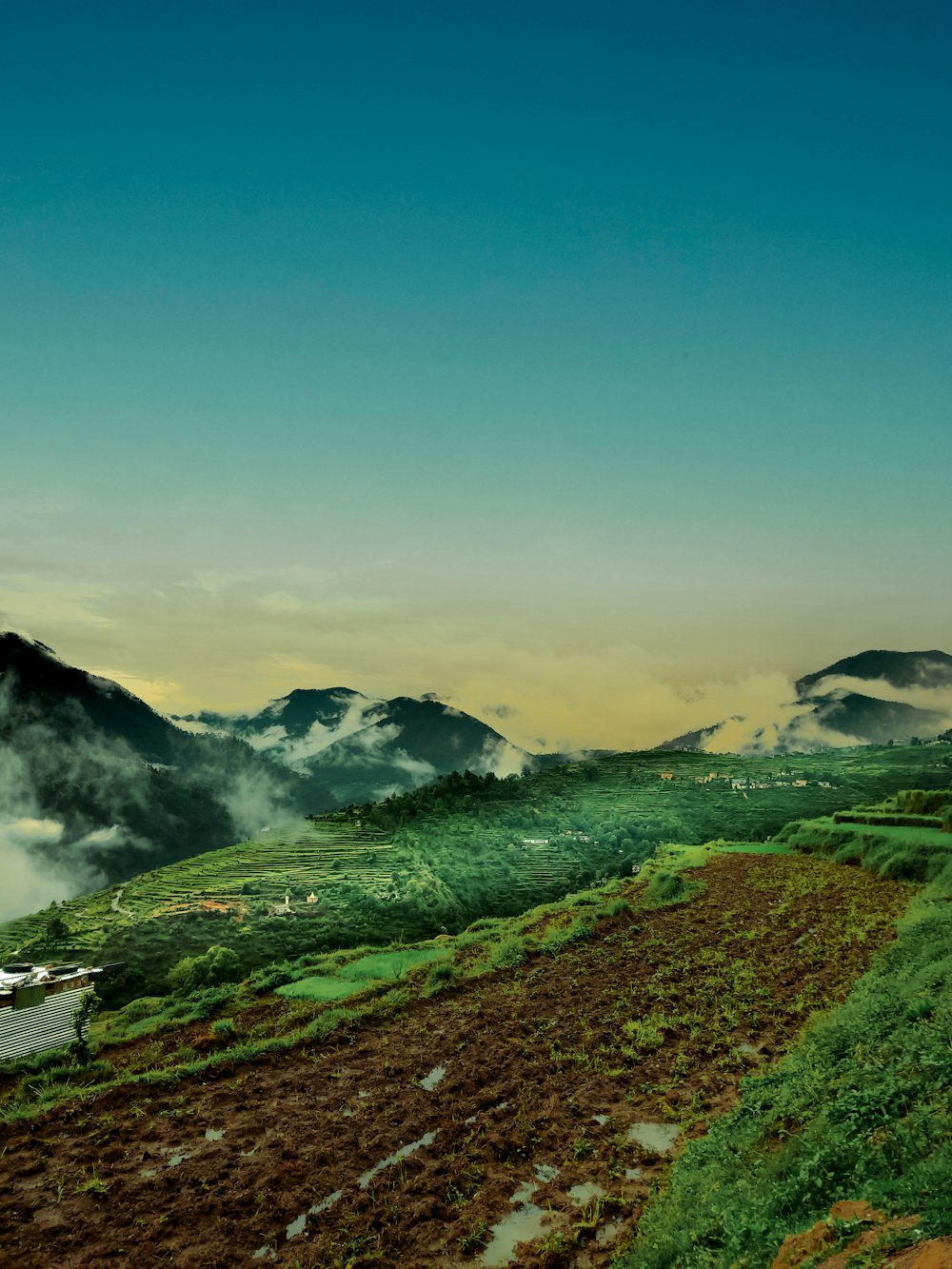 a scenic view of a mountain range in the distance