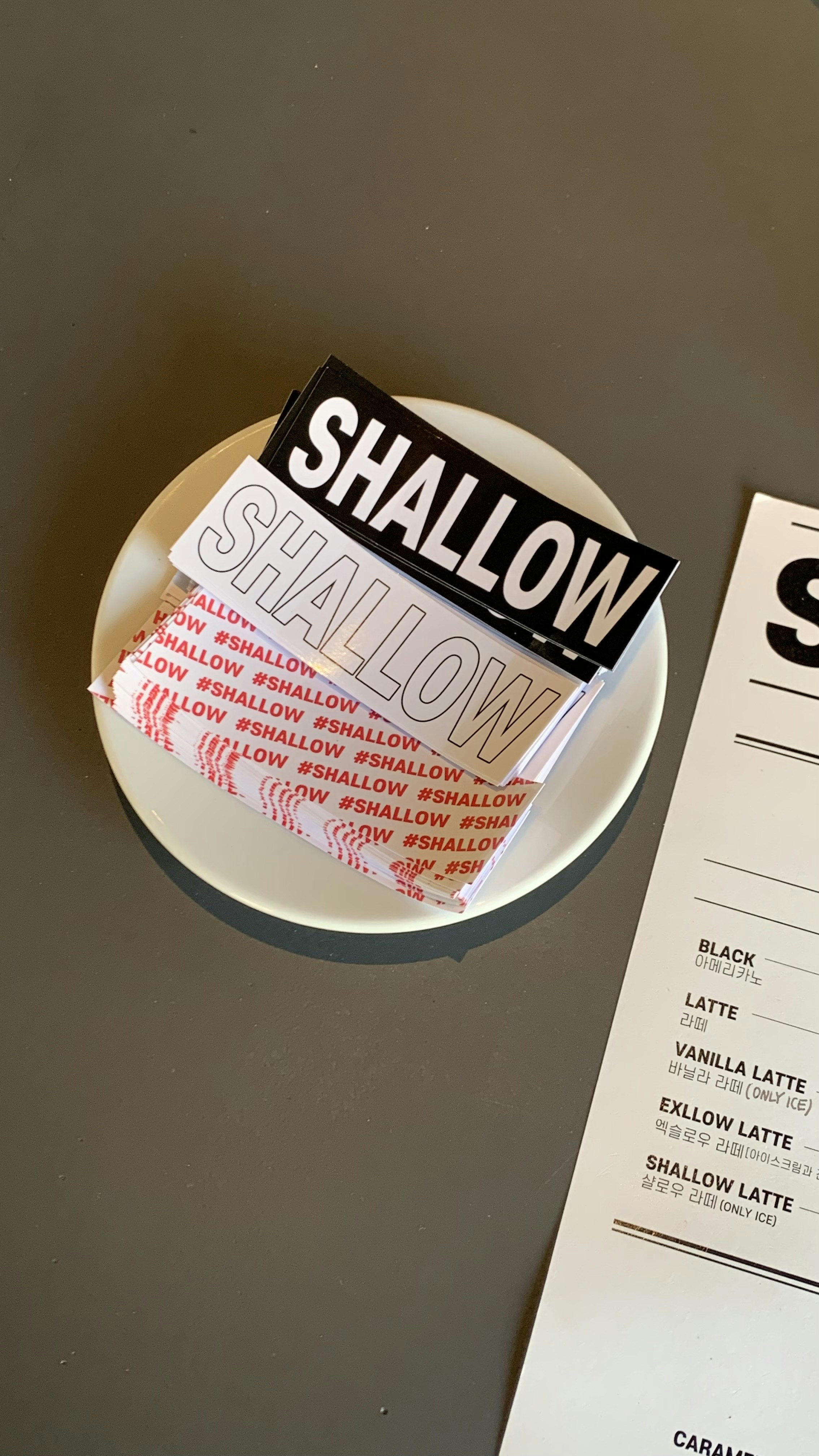 a plate with a sign on it next to a menu