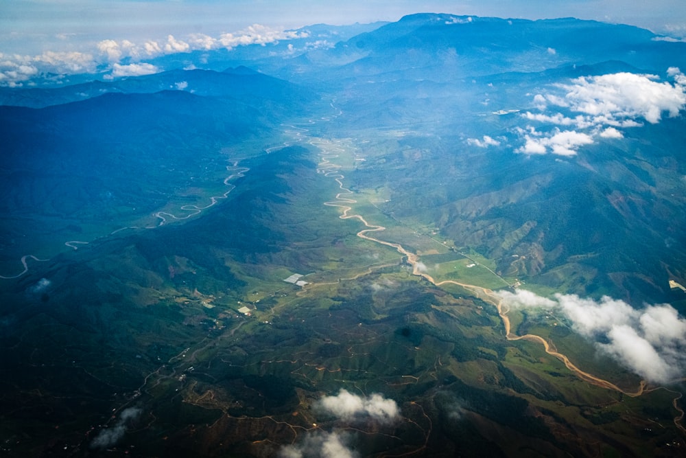 an aerial view of a river running through a valley