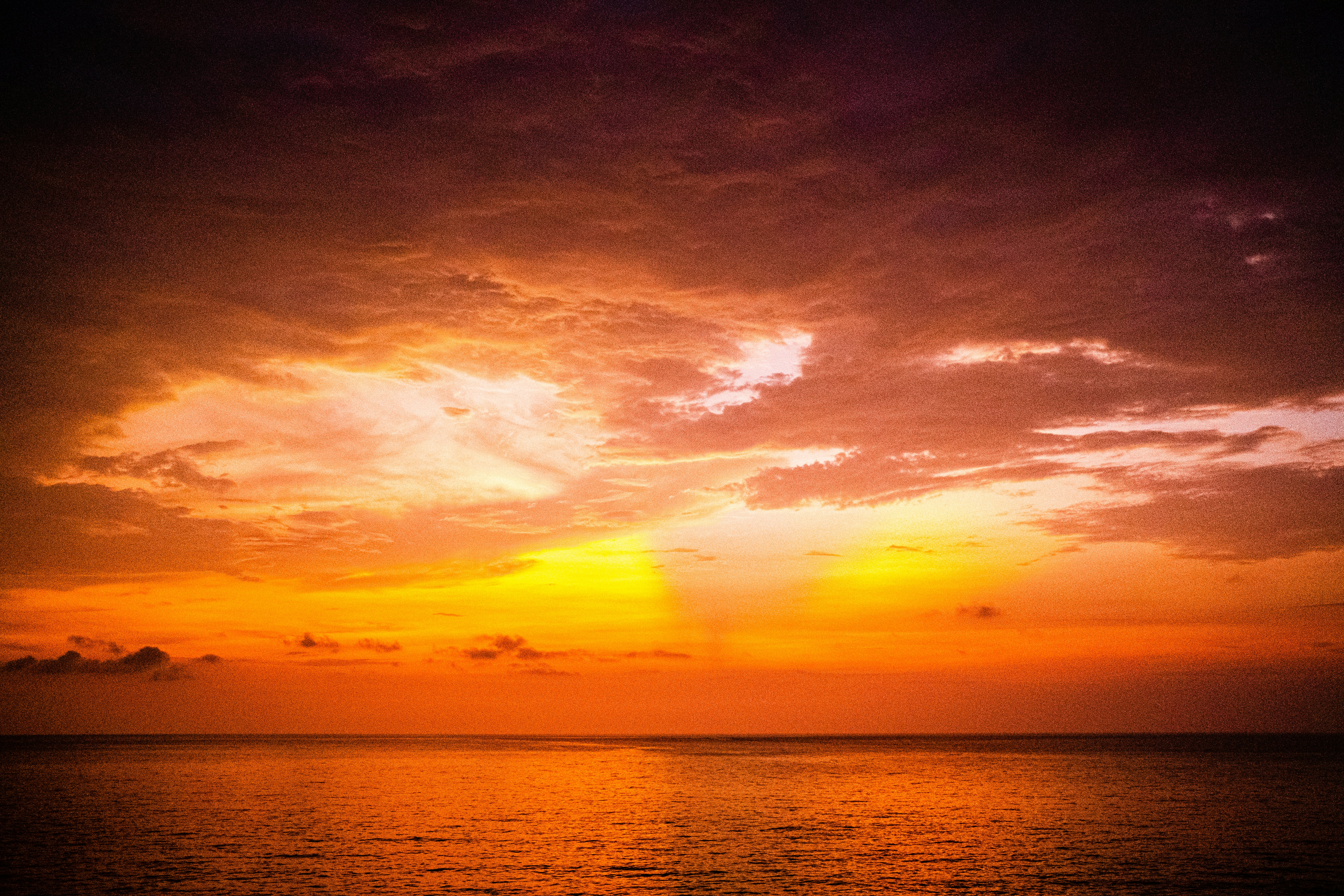 a sunset over a body of water