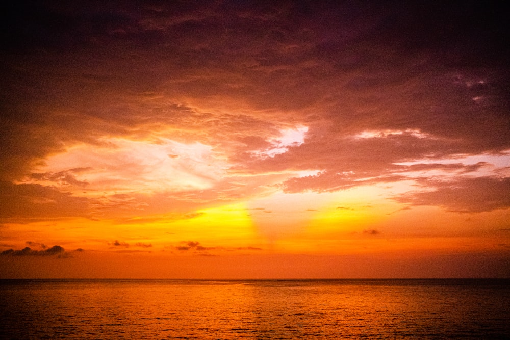 a sunset over a body of water