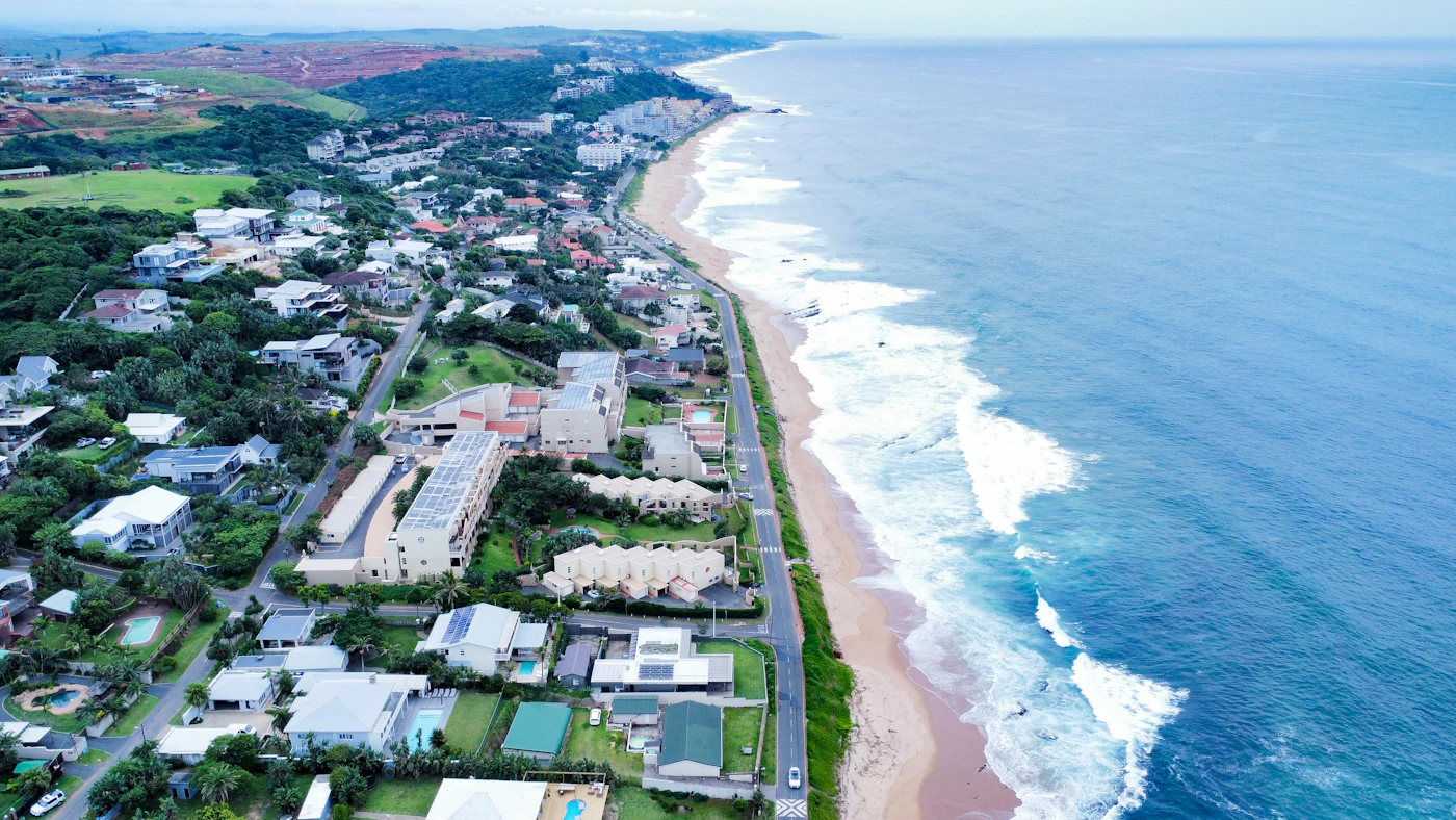 Umdloti from the air: the village, the beach road and surf breaking along the shore