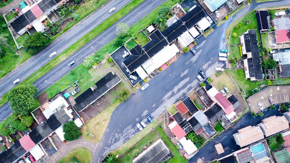 an aerial view of a street and houses