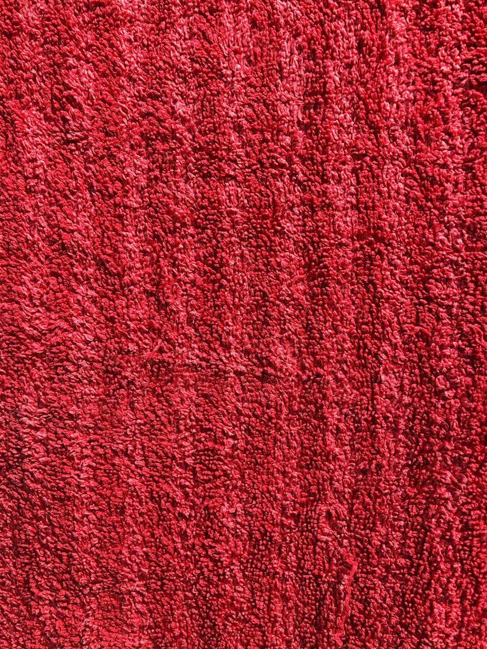 a close up of a red rug