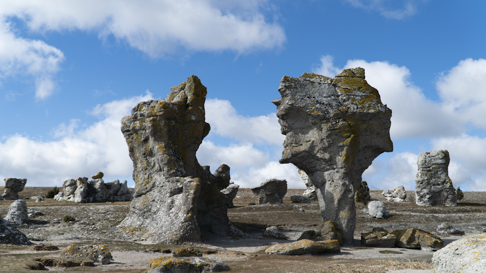 a large rock formation in the middle of a desert