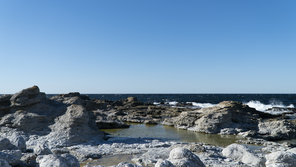 a large body of water surrounded by rocks