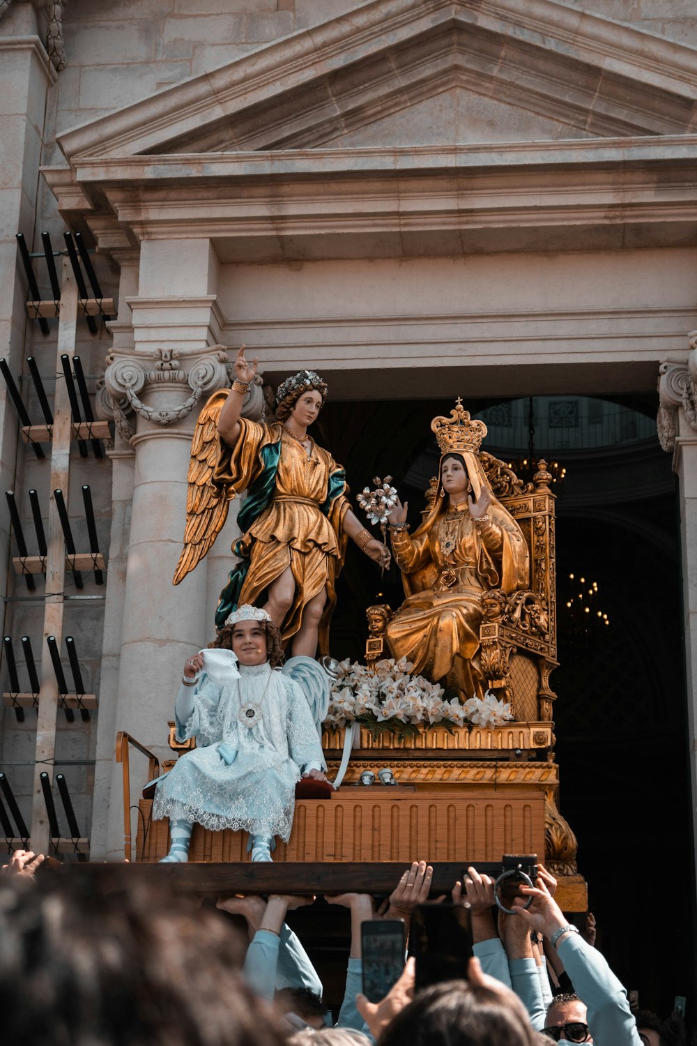 a group of people taking pictures of a statue