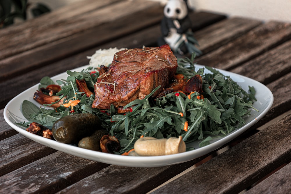 a plate of food on a wooden table